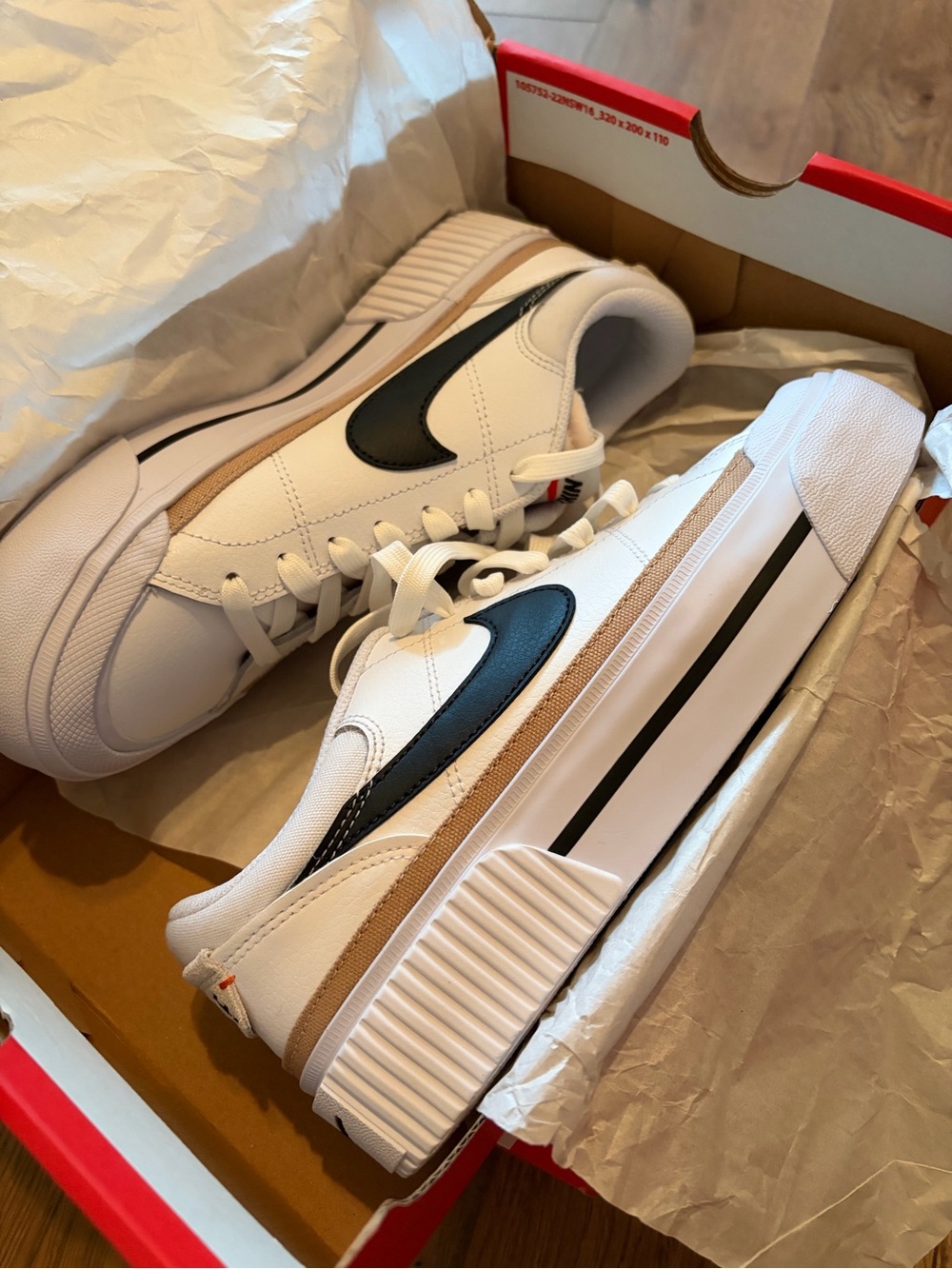 Nike White Sneakers with Black Swoosh and Tan Trim